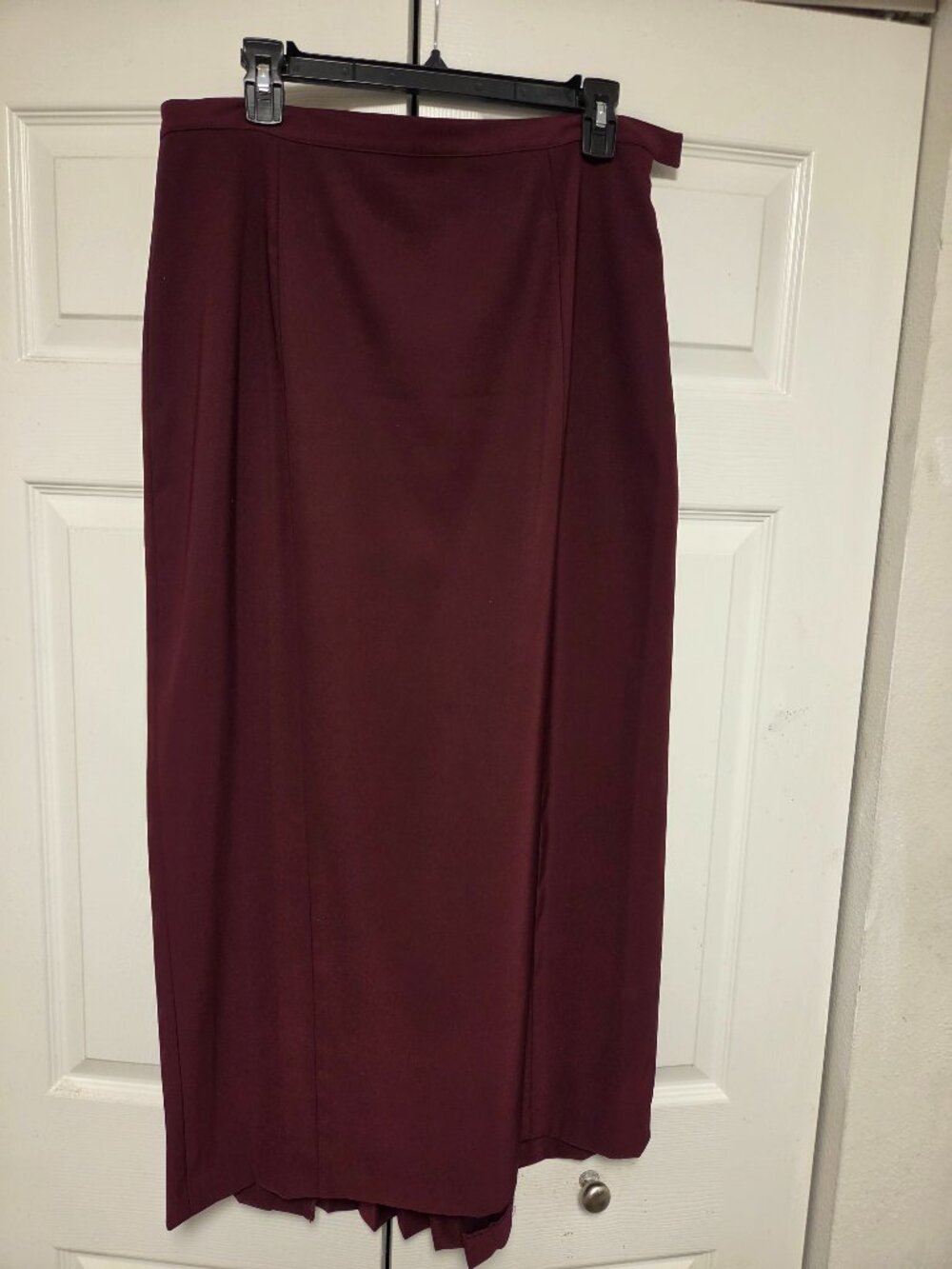 Elegant burgundy  skirt with pleats in the back.